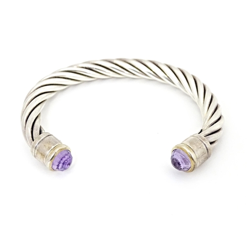 691 - Assorted silver and white metal jewellery comprising a bangle set with amethyst and assorted pendant... 