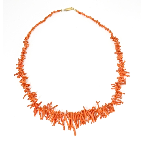 692 - A coral necklace of graduated coral branch beads. Approx  22