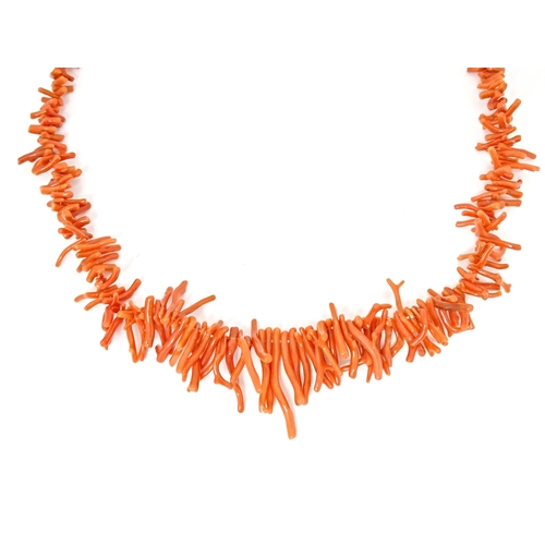 692 - A coral necklace of graduated coral branch beads. Approx  22