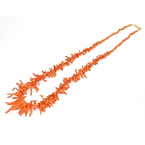 692 - A coral necklace of graduated coral branch beads. Approx  22