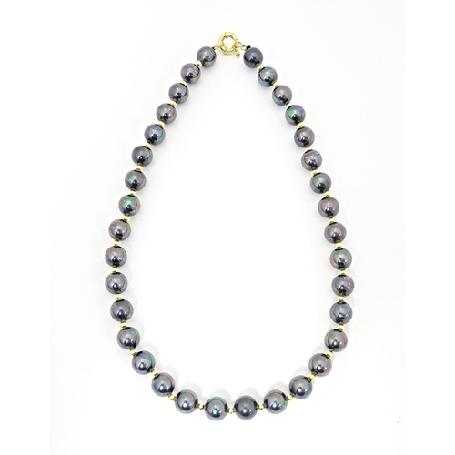 697 - A gilt metal and black pearl bead necklace approx 18