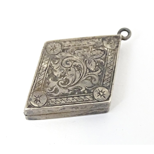 700 - A Victorian silver pendant locket of diamond form with engraved decoration. Hallmarked Birmingham 18... 