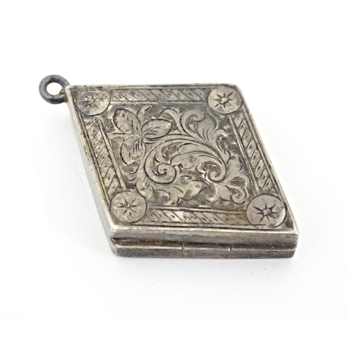 700 - A Victorian silver pendant locket of diamond form with engraved decoration. Hallmarked Birmingham 18... 