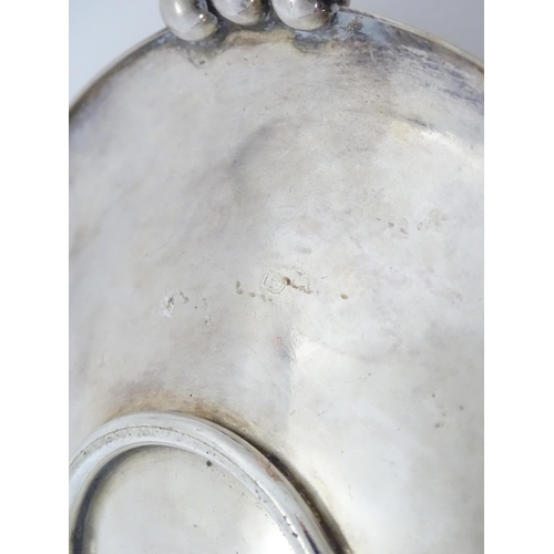 965 - An Art Deco silver plate bon bon dish with hammered decoration and spherical ball handles. Approx 6