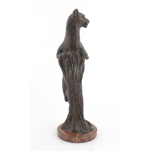 978 - A 20thC Continental cast patinated bronze model of a leopard / big cat on a styled tree stump. On a ... 