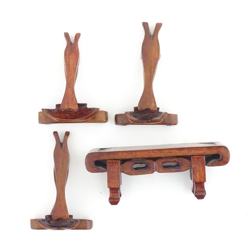 989 - Four Oriental agate models of musical instruments to include lute, quqin, etc. with wooden stands. L... 