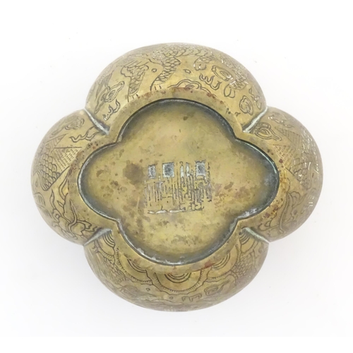 990 - A Chinese brass lobed pot decorated with dragons, phoenix birds and pagoda buildings. Character mark... 