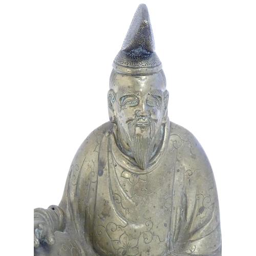 1007 - A 20thC Japanese cast model of a seated gentleman, possibly the scholar Sugawara no Michizane. Appro... 