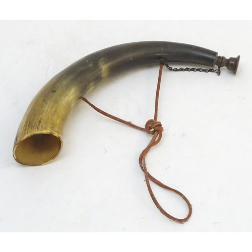 1036 - A Continental hunting horn, the bovine horn with brass mouthpiece and leather strap. Approx. 13