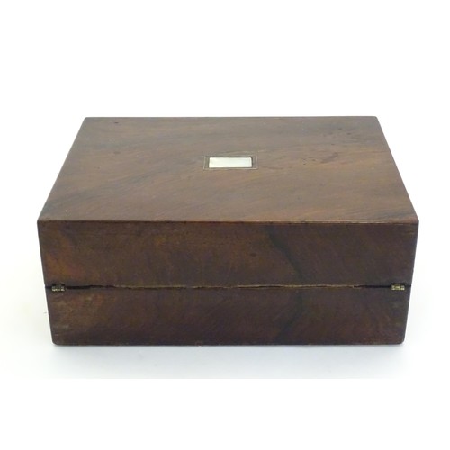 1038 - A Victorian rosewood writing box with inlaid mother of pearl to top, opening to reveal a fitted inte... 