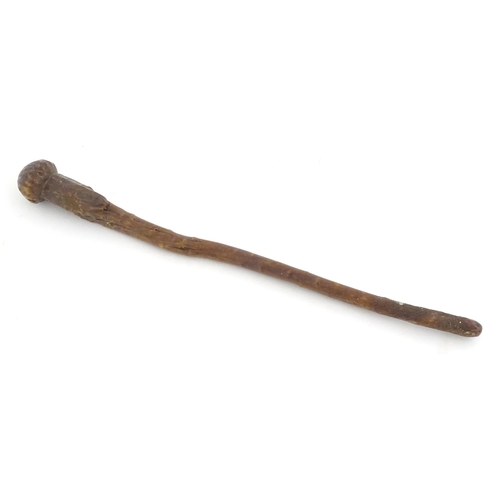 1043 - Ethnographic / Native / Tribal: An African club / knobkerrie with knob to one end and incised cross ... 