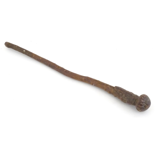 1043 - Ethnographic / Native / Tribal: An African club / knobkerrie with knob to one end and incised cross ... 