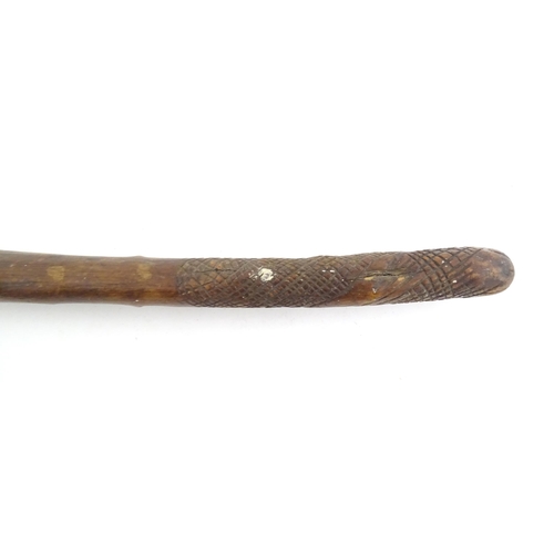 1043 - Ethnographic / Native / Tribal: An African club / knobkerrie with knob to one end and incised cross ... 