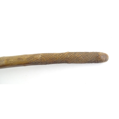 1043 - Ethnographic / Native / Tribal: An African club / knobkerrie with knob to one end and incised cross ... 