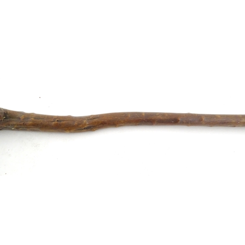 1043 - Ethnographic / Native / Tribal: An African club / knobkerrie with knob to one end and incised cross ... 