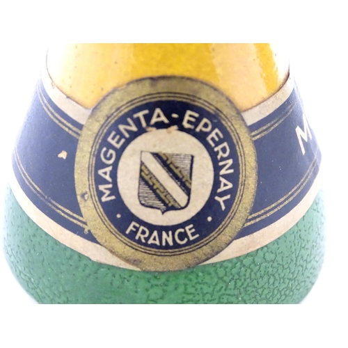 1054 - A 20thC French novelty ceramic mustard pot formed as a champagne bottle. Approx. 6 1/2