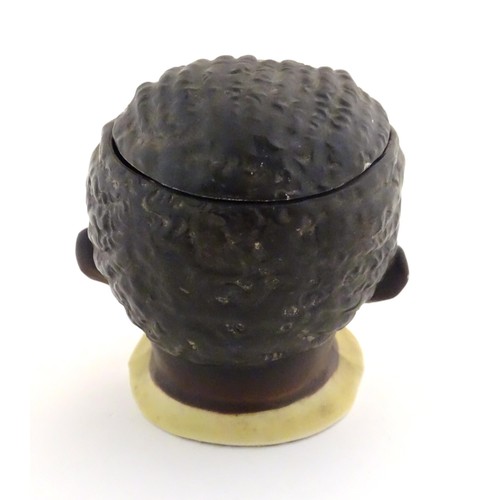 1092 - A Continental novelty tobacco jar formed as the head of a male figure smoking a pipe. Approx. 4 3/4