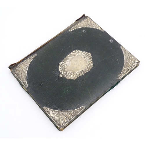 1096 - An early 20thC green leather blotter with embossed silver mounts hallmarked London 1902, maker Willi... 