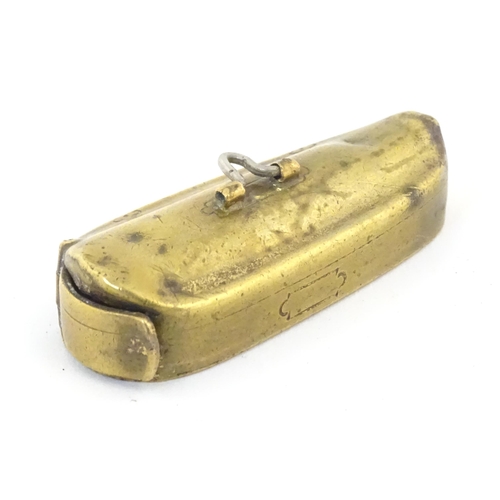 1139 - A 19thC brass vesta case modelled as a stylised instrument case. Approx. 2