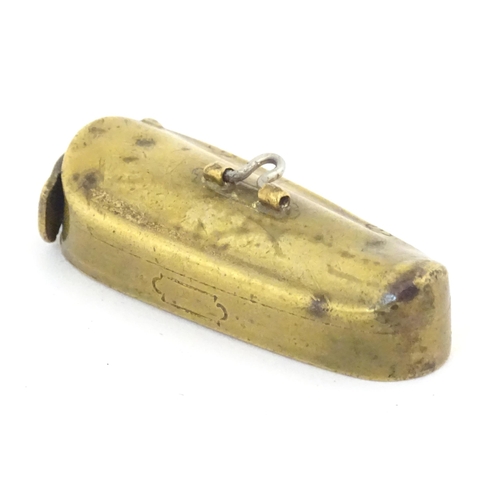 1139 - A 19thC brass vesta case modelled as a stylised instrument case. Approx. 2