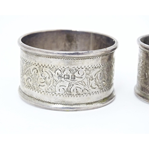 375 - Two silver napkin rings with engraved acanthus scroll decoration, hallmarked Birmingham 1905, maker ... 