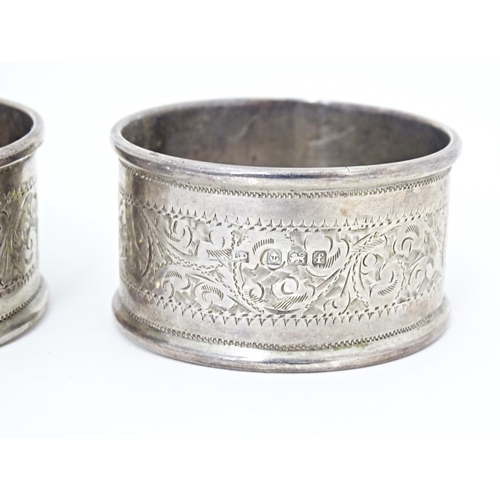 375 - Two silver napkin rings with engraved acanthus scroll decoration, hallmarked Birmingham 1905, maker ... 