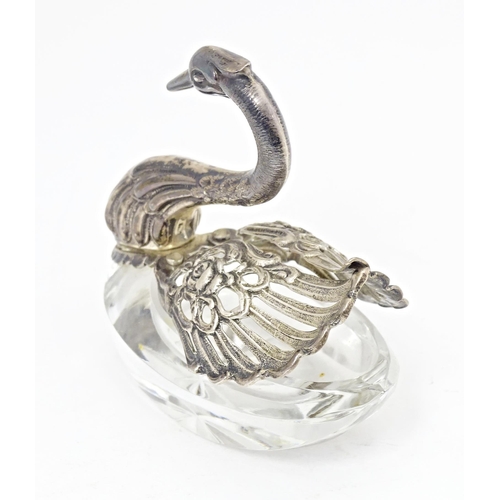 376 - A novelty cut glass salt with silver mounts modelled as a swan, bearing import marked for London 197... 