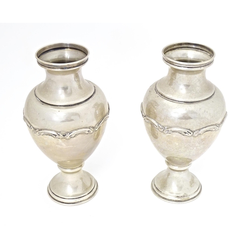 388 - A pair of Continental .835 silver vases with scroll detail, bearing Portuguese marks under. Approx. ... 