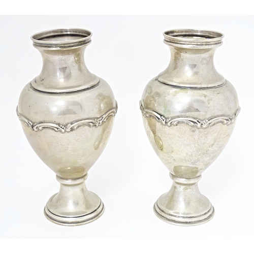 388 - A pair of Continental .835 silver vases with scroll detail, bearing Portuguese marks under. Approx. ... 