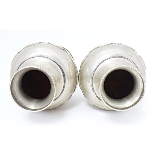 388 - A pair of Continental .835 silver vases with scroll detail, bearing Portuguese marks under. Approx. ... 