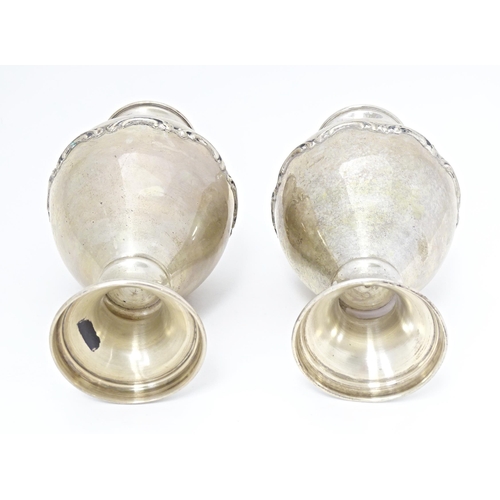 388 - A pair of Continental .835 silver vases with scroll detail, bearing Portuguese marks under. Approx. ... 