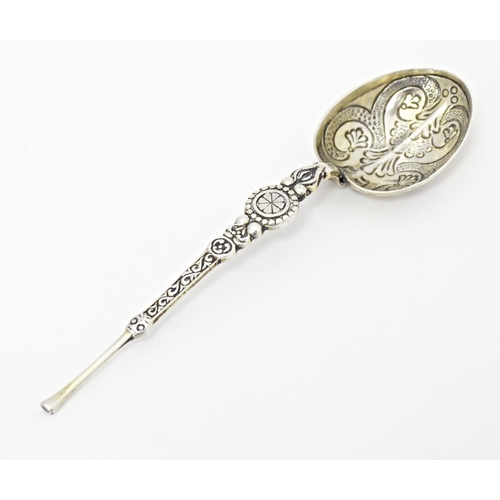 389 - A silver miniature replica anointing spoon hallmarked Birmingham 1908, maker M. Bros. Together with ... 