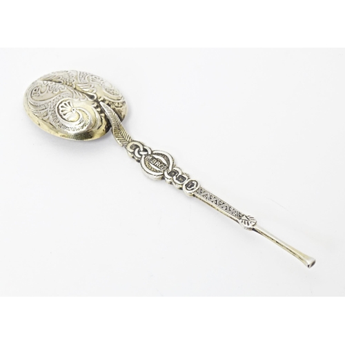 389 - A silver miniature replica anointing spoon hallmarked Birmingham 1908, maker M. Bros. Together with ... 