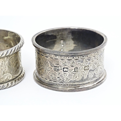 391 - Four various hallmarked silver napkin rings  with engraved decoration. (4)