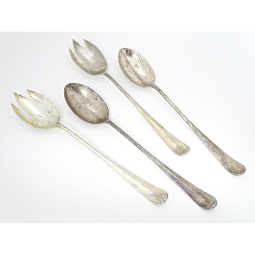 523 - Four large silver plate serving spoons / forks. approx 12 1/2