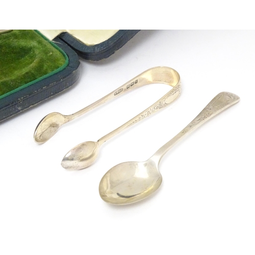 503 - A cased set of six silver teaspoons with tongs en suite, having engraved desecration. Hallmarked She... 