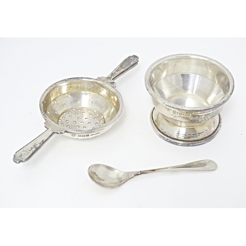 322 - An Art Deco style silver twin handled tea / lemon strainer with stand hallmarked Birmingham 1960, ma... 