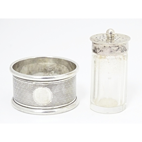 330 - A cut glass pepperette with silver top hallmarked Sheffield 1923, maker Stevenson & Law. Together wi... 