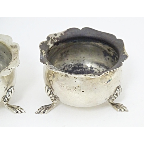 331 - A pair of silver salts with blue glass liners hallmarked Chester 1908, maker George Nathan & Ridley ... 