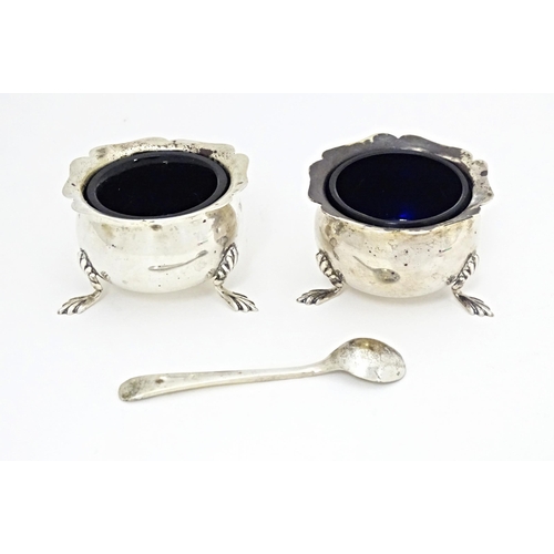 331 - A pair of silver salts with blue glass liners hallmarked Chester 1908, maker George Nathan & Ridley ... 