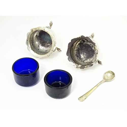 331 - A pair of silver salts with blue glass liners hallmarked Chester 1908, maker George Nathan & Ridley ... 