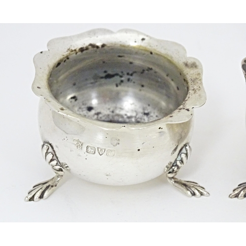 331 - A pair of silver salts with blue glass liners hallmarked Chester 1908, maker George Nathan & Ridley ... 