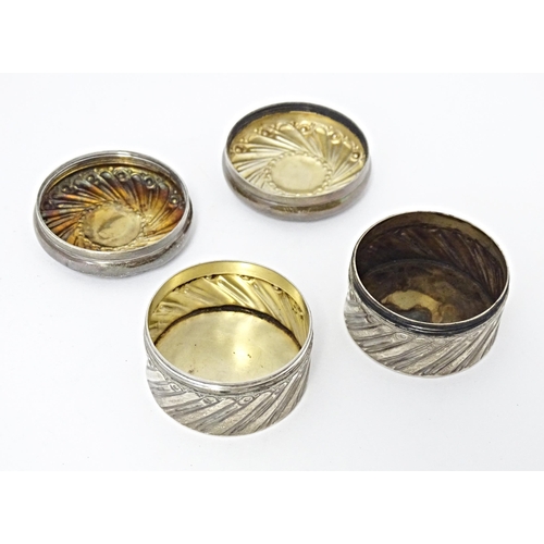 333 - A pair of Victorian silver pots and covers with embossed decoration hallmarked London 1892, maker Ch... 