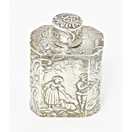 337 - A Continental silver miniature caddy / flask decorated with figures in a landscape. Import marks for... 