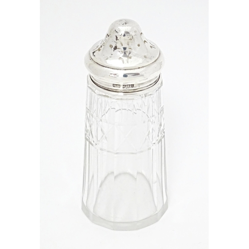 349 - A cut glass sugar sifter with silver lid hallmarked Birmingham 1913 maker Sydney & Co. Approx. 5 1/2... 