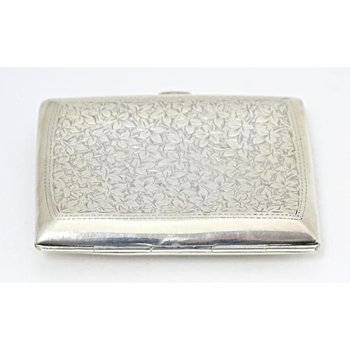 355 - A silver cigarette case of shaped form with engraved foliate detail, hallmarked Birmingham 1904, mak... 