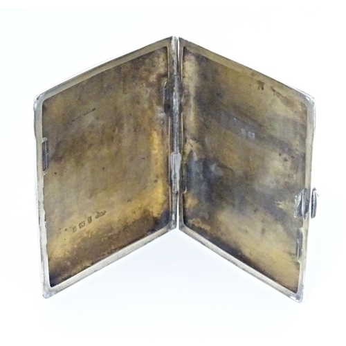 355 - A silver cigarette case of shaped form with engraved foliate detail, hallmarked Birmingham 1904, mak... 