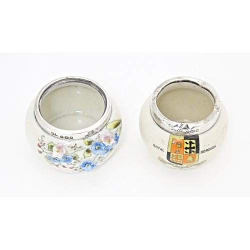 358 - Two ceramic salts with silver rims, one with forget me not flower detail, the other with crest for K... 