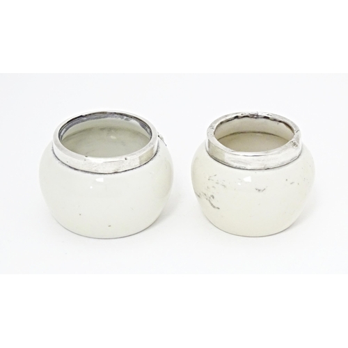 358 - Two ceramic salts with silver rims, one with forget me not flower detail, the other with crest for K... 