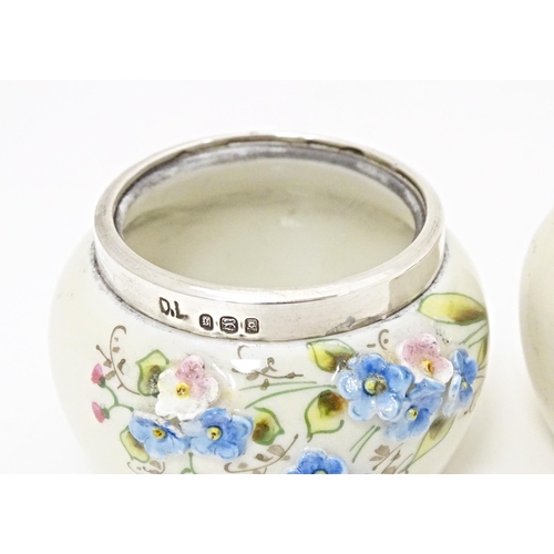 358 - Two ceramic salts with silver rims, one with forget me not flower detail, the other with crest for K... 